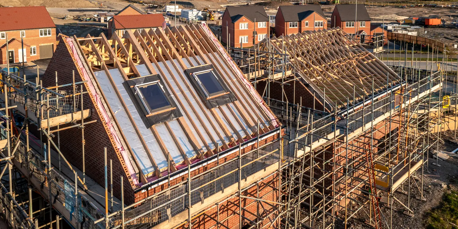 House extension under construction with scaffolding to the rear elevation