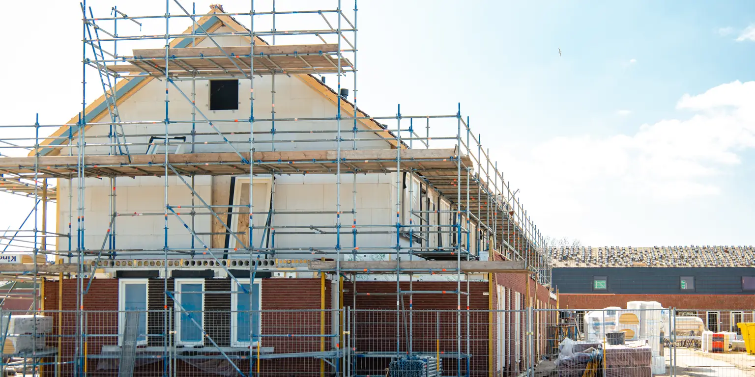 New houses under construction in a suburban street