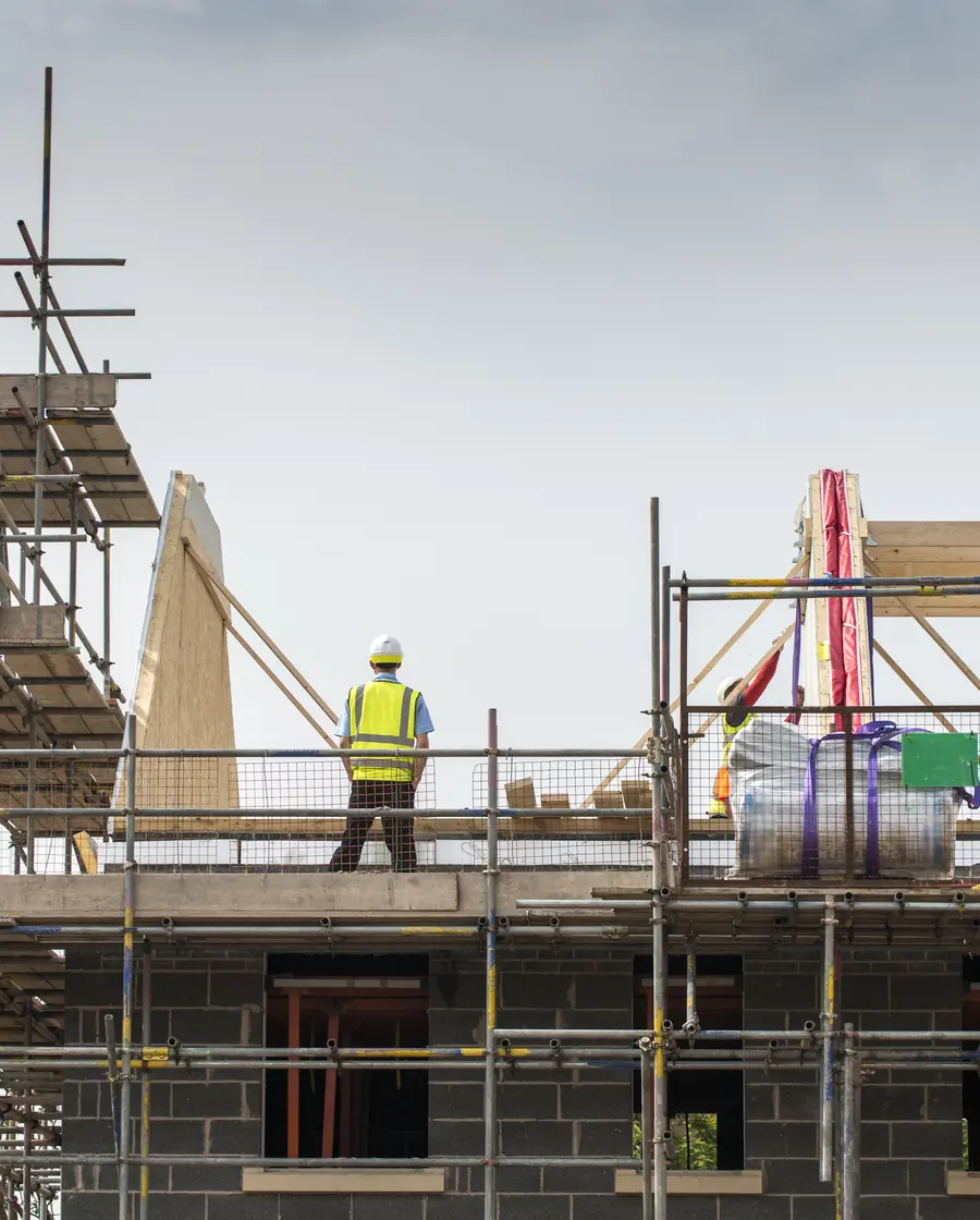 Contractors at work on a scaffolded building