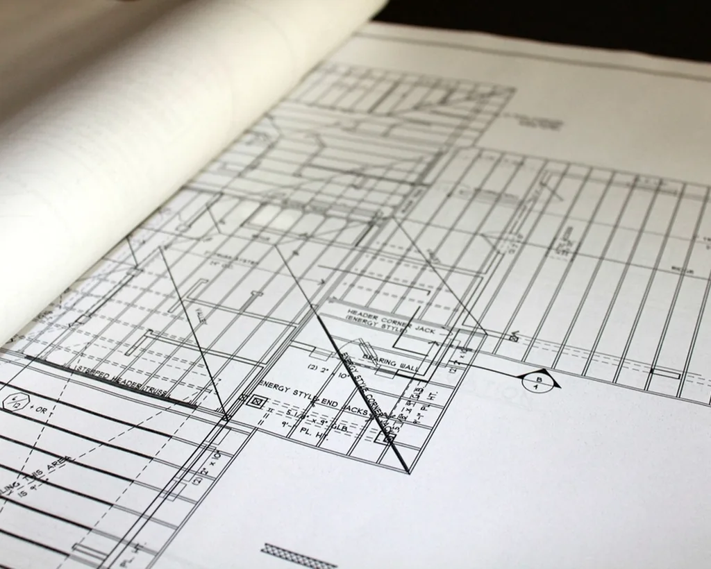 Quantity surveyor reviewing drawings on a construction site
